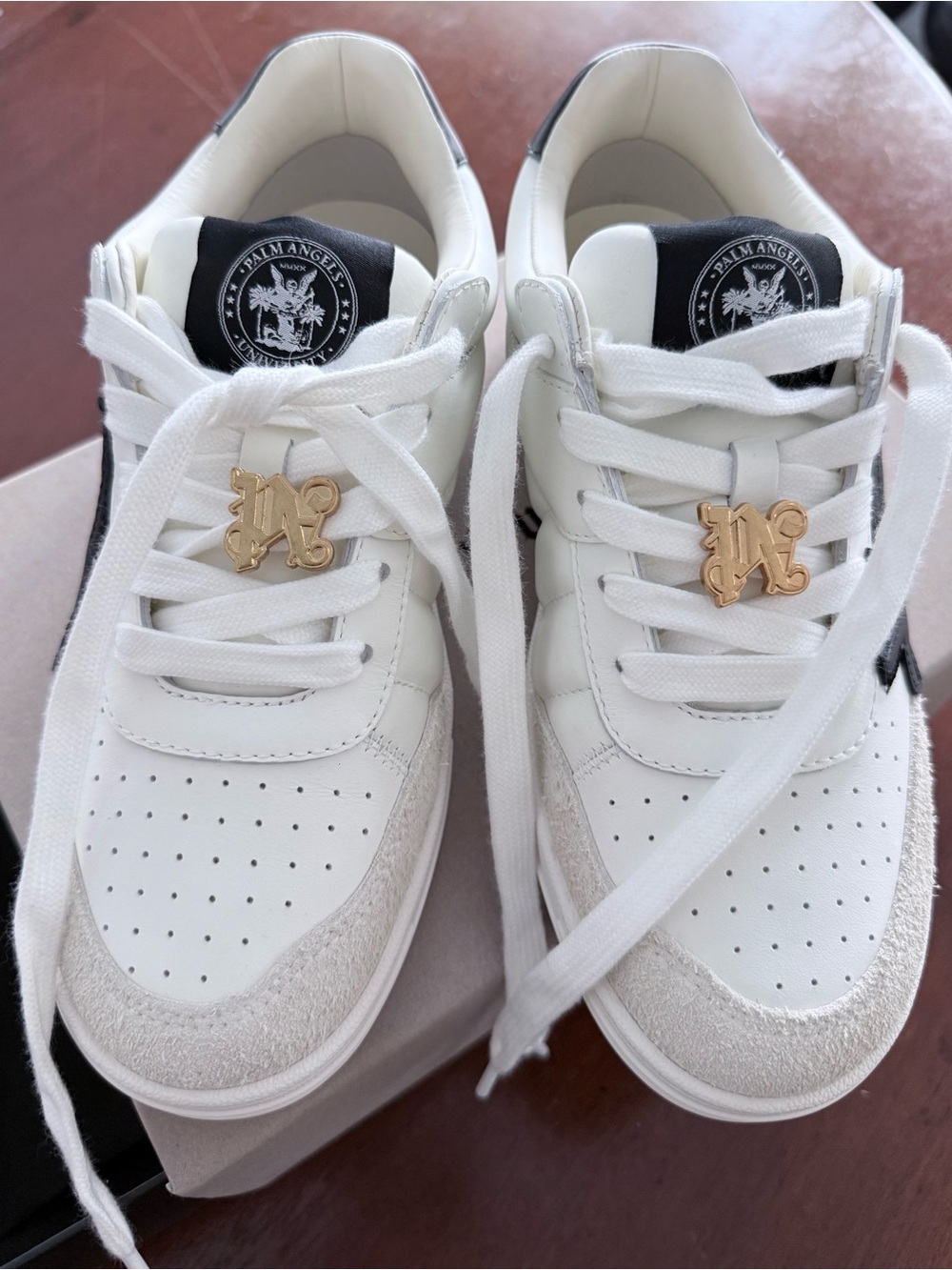 Palm Angels Mens White Sneakers with Black Accents and Gold Charm